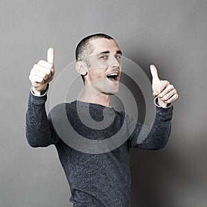 Excited 30s man with thumbs up for success