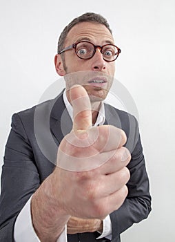 Excited 40s businessman approving corporate decision with thumb up