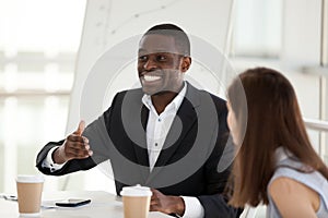 Excited African American employee speak emotional at business me