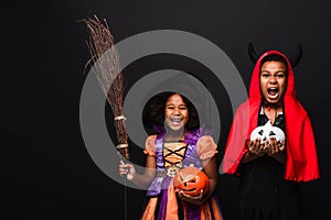 excited african american kids in halloween