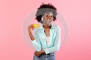 Excited African American Lady Holding Credit Card Posing Over Pink Background