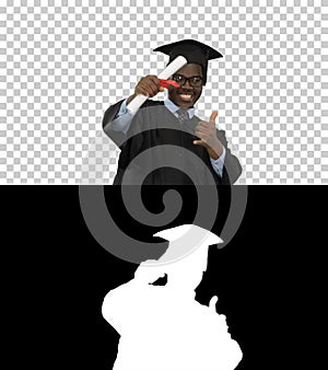 Excited african american male student in graduation robe waiving