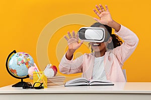 Excited African American Schoolgirl Wearing Virtual Reality Glasses