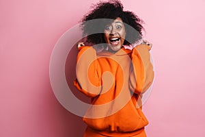 Excited african american woman screaming and gesturing on camera