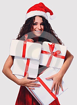 Excited attractive woman with many gift boxes and bags.