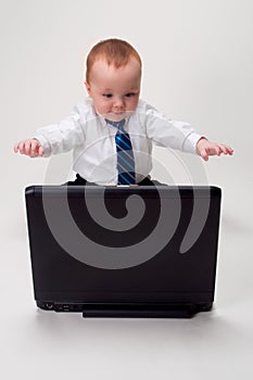 Excited baby businessman