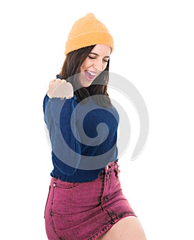 Excited beautiful young woman with closed eyes and clenched fists, isolated on white background. Yes concept. Good news