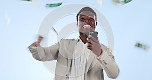 Excited black man, phone and money rain in financial freedom or winning lottery against a studio background. Happy