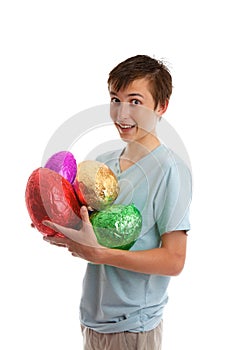 Excited boy holding chocolate easter eggs