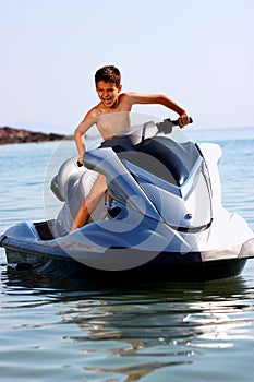 Excited boy on jet ski