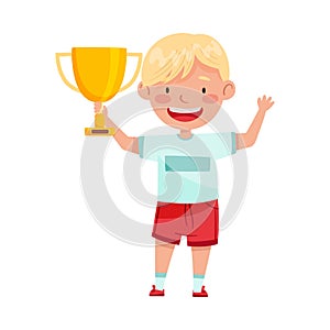 Excited Boy Winner Standing with Gold Cup as Achievement Award Vector Illustration