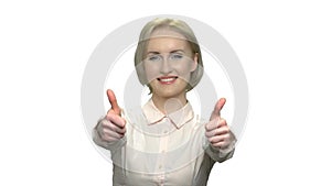 Excited business woman giving two thumbs up.
