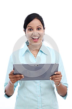 Excited business woman with touch pad PC