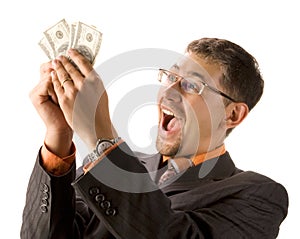 Excited businessman with dollars