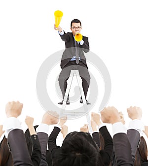 Excited businessman encourage with cheer megaphone to team