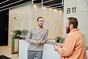 excited businessman in eyeglasses and casual