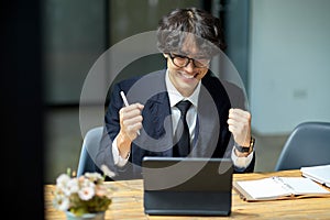 Excited businessman receiving a new job offer email, getting work promotion