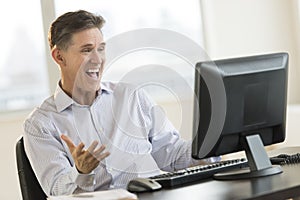 Excited Businessman Shouting White Using Desktop Pc