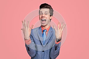 Excited businessman showing 9 fingers