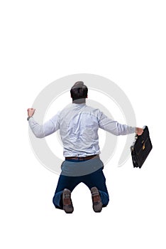 The excited businessman siiting on the knees isolated on white background