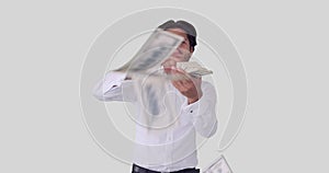 Excited businessman throwing out cash dollars
