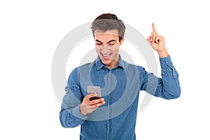 Excited casual man reading good news on his smartphone