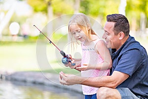 Excited Caucasian Father and Daughter Having Fun Fishing At The La