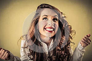 Excited cheering young woman