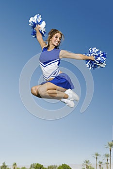 Excited Cheerleader Jumping photo