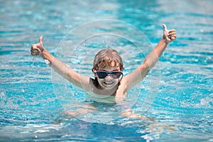 Excited child relax in summer swimming pool. Children play in tropical resort. Family beach vacation.