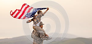 Excited child sitting with american flag on shoulders of father reunited with family