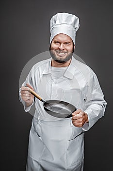 Excited cook showing empty skillet