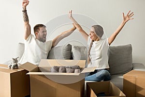 Excited couple glad to move into new home celebrating together