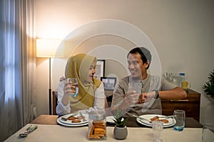 excited couple having iftar dinner time together