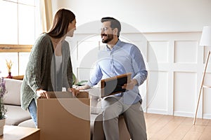 Excited couple renters unpack moving or relocating