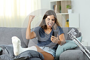 Excited disabled woman receiving online news