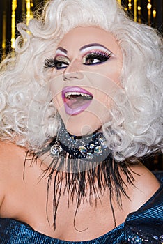 excited drag queen with spectacular makeup