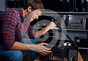 Excited emotional man opening the system unit