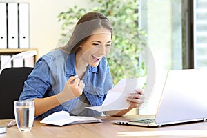 Excited entrepreneur girl reading a letter