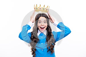 Excited face. Teenage selfish girl celebrates success victory. Teen child in queen crown isolated on white background