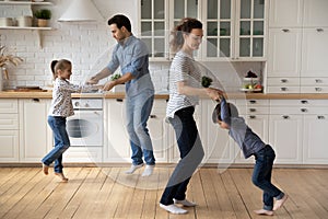 Excited family having fun due to moving into new house