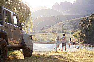 Excited Family Reaching Countryside Destination On Road Trip