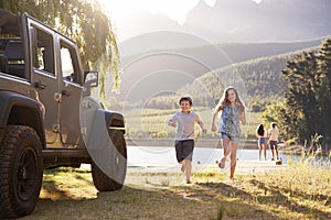 Excited Family Reaching Countryside Destination On Road Trip