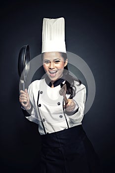Excited female chef or baker ready to cook