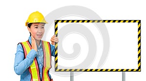 Excited female worker with Protection Equipment, posing behind b