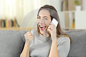 Excited girl receiving good news during a phone call