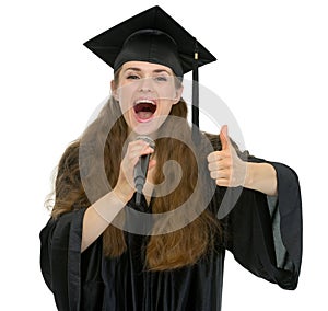 Excited graduation student speaking microphone