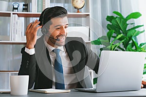 Excited and happy businessman dressed in black formal suit. Fervent