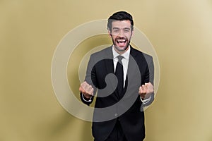 Excited and happy businessman dressed in black formal suit. Fervent