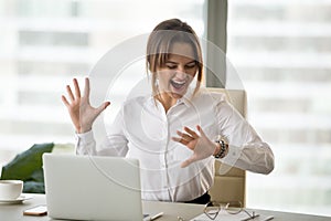 Excited happy employee looking at wristwatch satisfied with meet